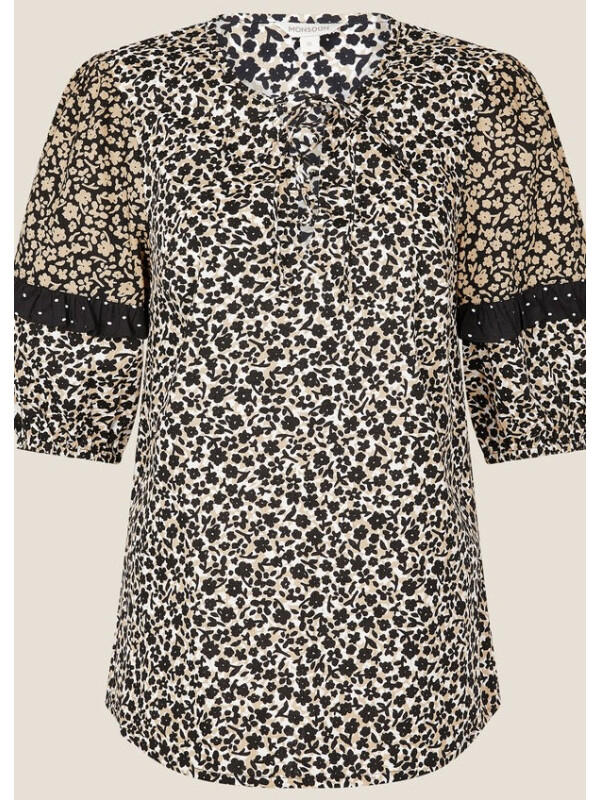 Top negru cu imprimeu floral monocrom și detalii cu volane